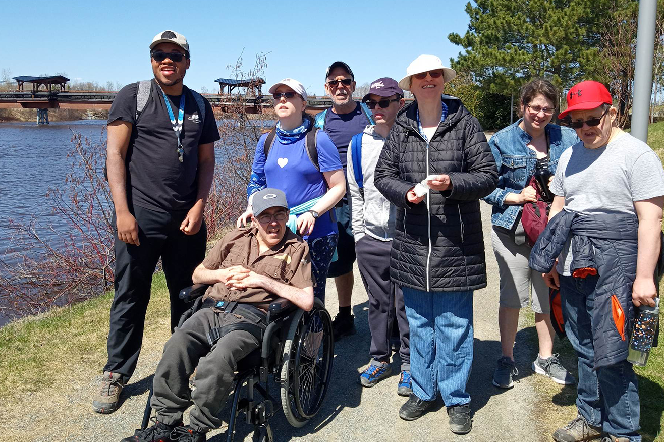 Abitibi - A group of community members outside by a river
