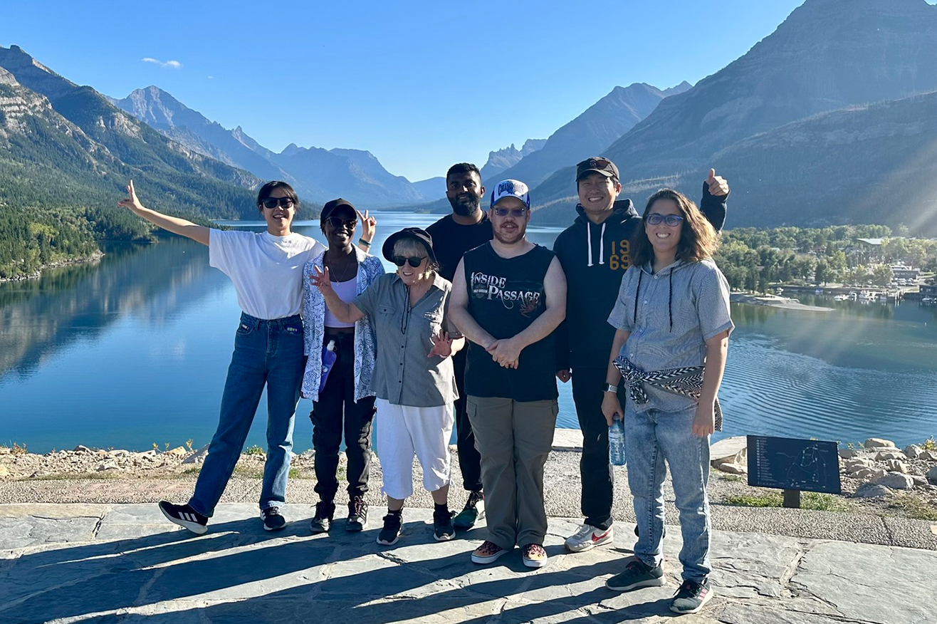calgary community members in front of a lake