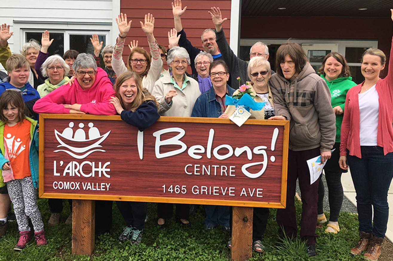 comox valley - community members in front of a big sign