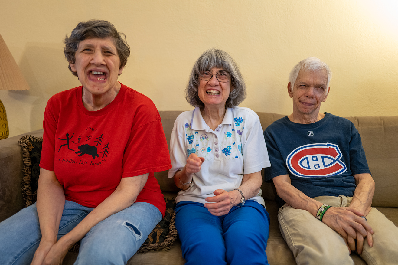 Montreal - three coremembers on a couch smiling