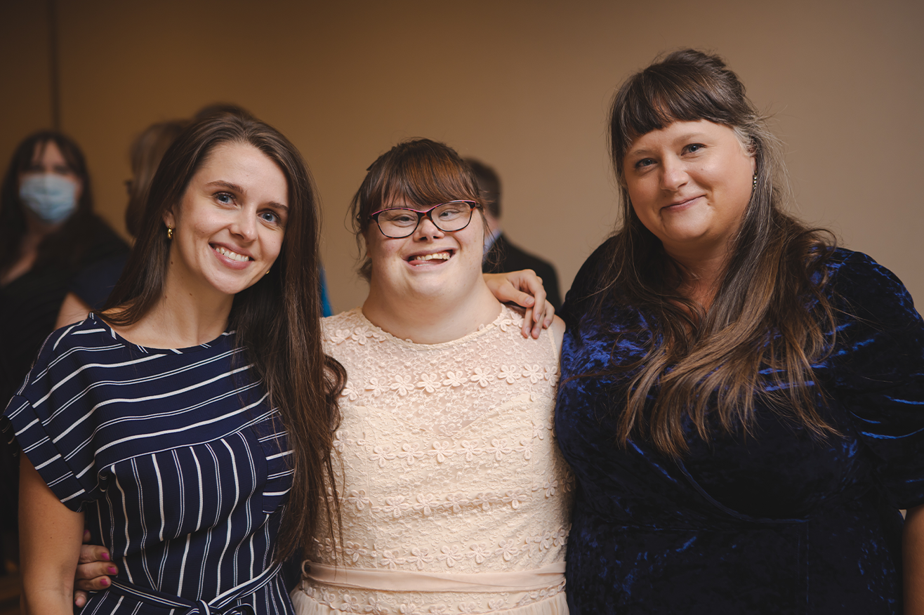 St John - three community members at a gala