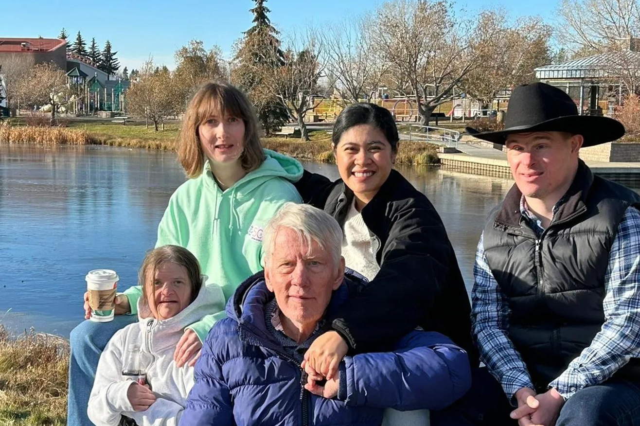 L'Arche Edmonton community member in front of a river