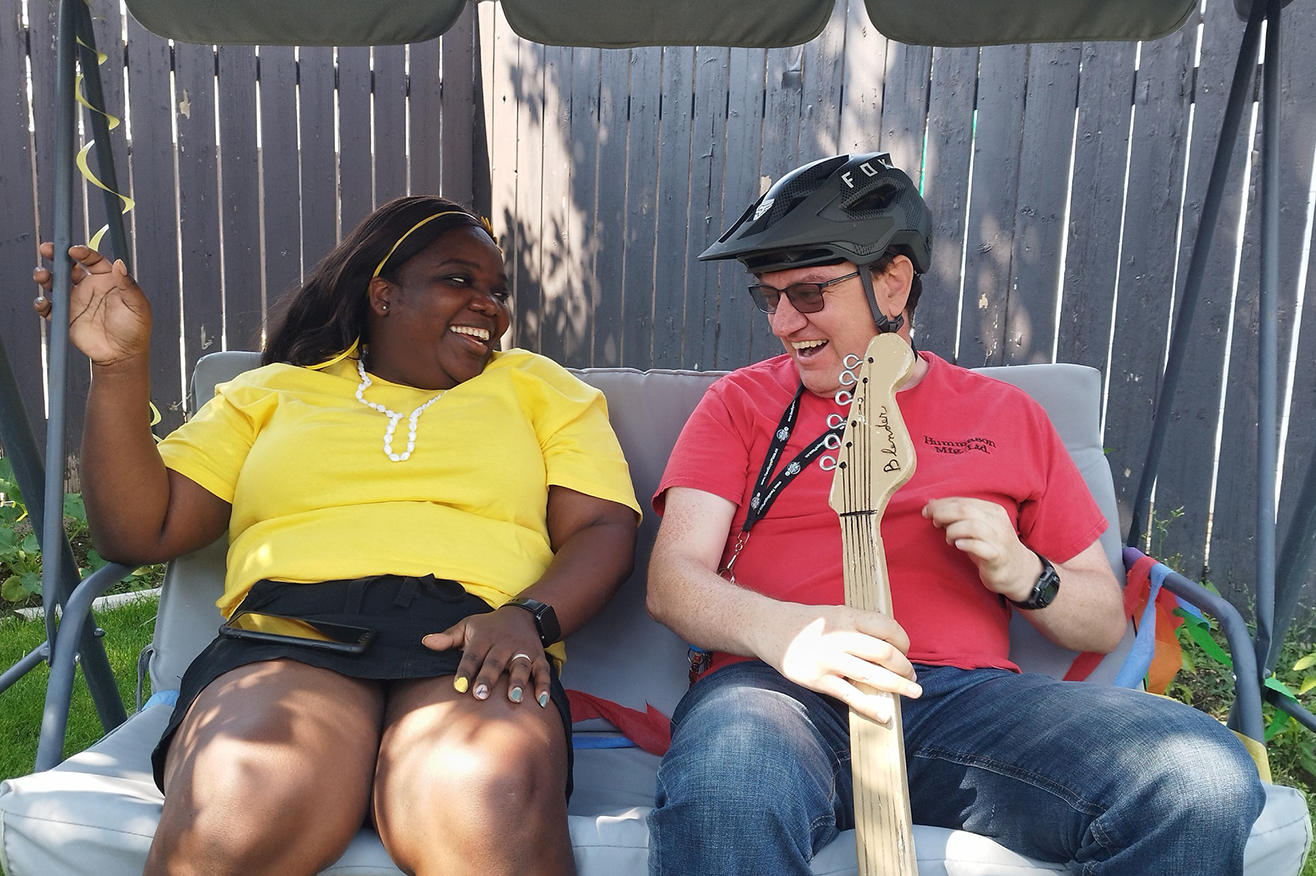 Lethbridge - Two Community members on a swing